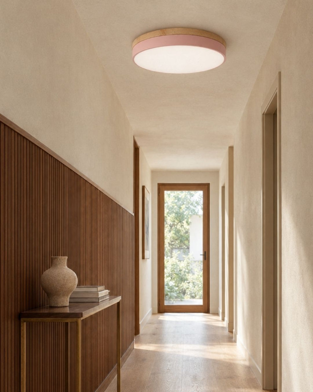 Feno ceiling light in pink, above a hallway at home