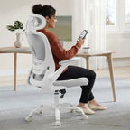 a woman sitting on a grey Deskon ergonomic chair with a headrest