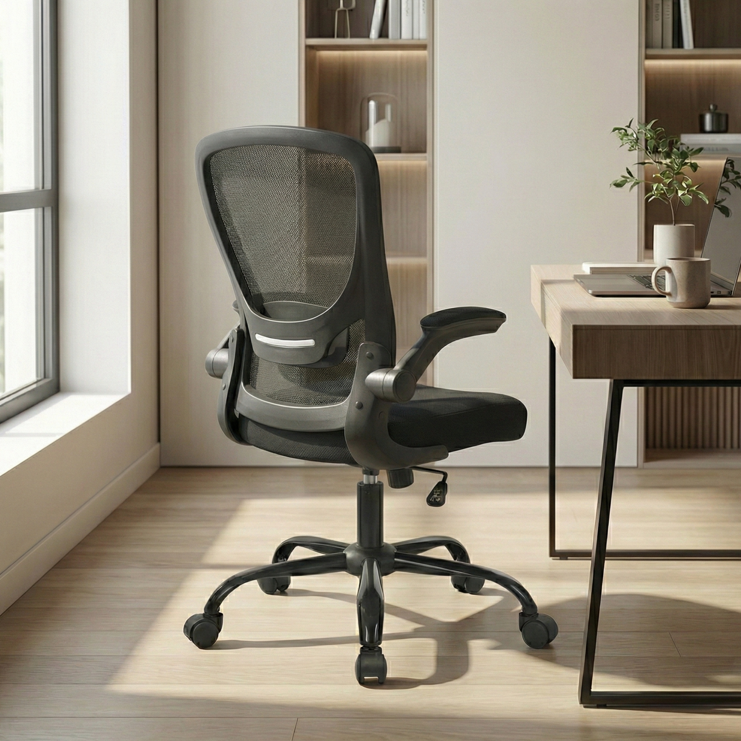 Deskon black office chair in a modern office, back view