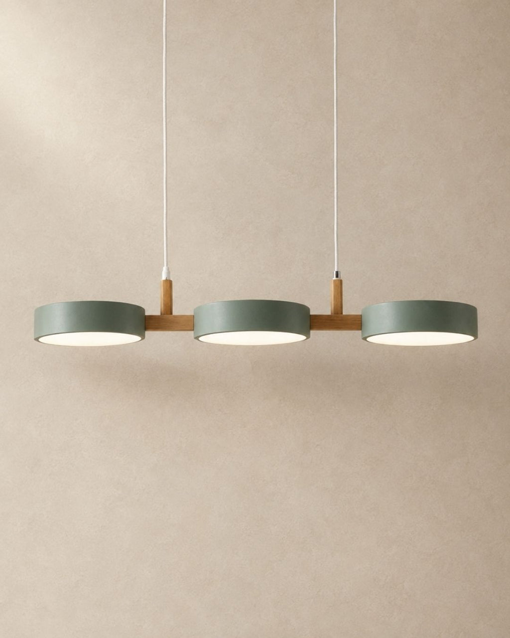 Brant pendant light in green, three fixtures, product photograph