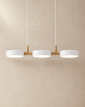 Brant pendant light in white, three fixtures, product photograph