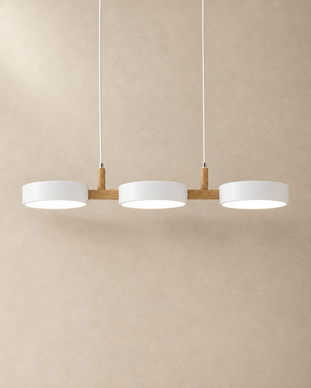 Brant pendant light in white, three fixtures, product photograph