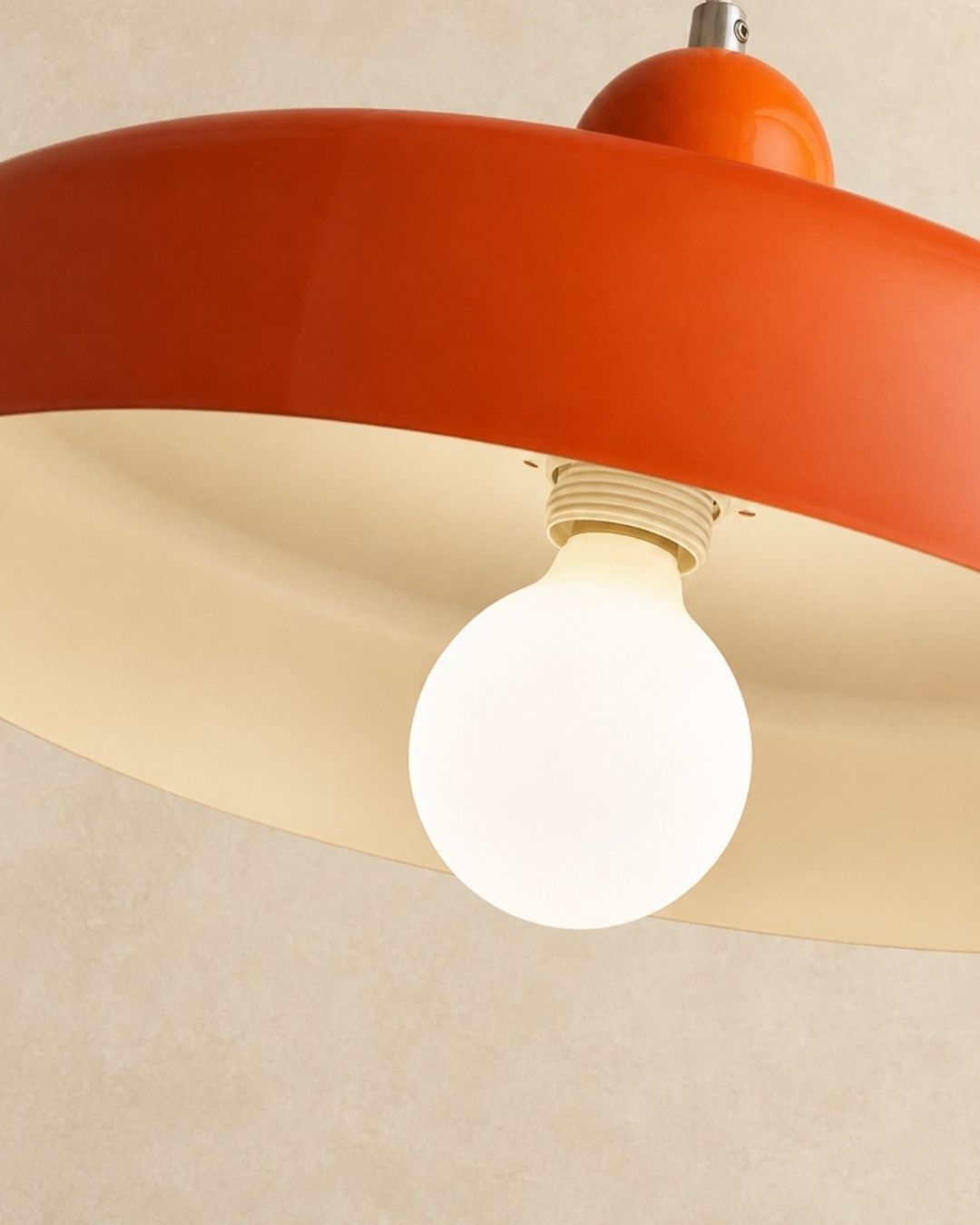 Nyla pendant light in orange, close view of the bulb