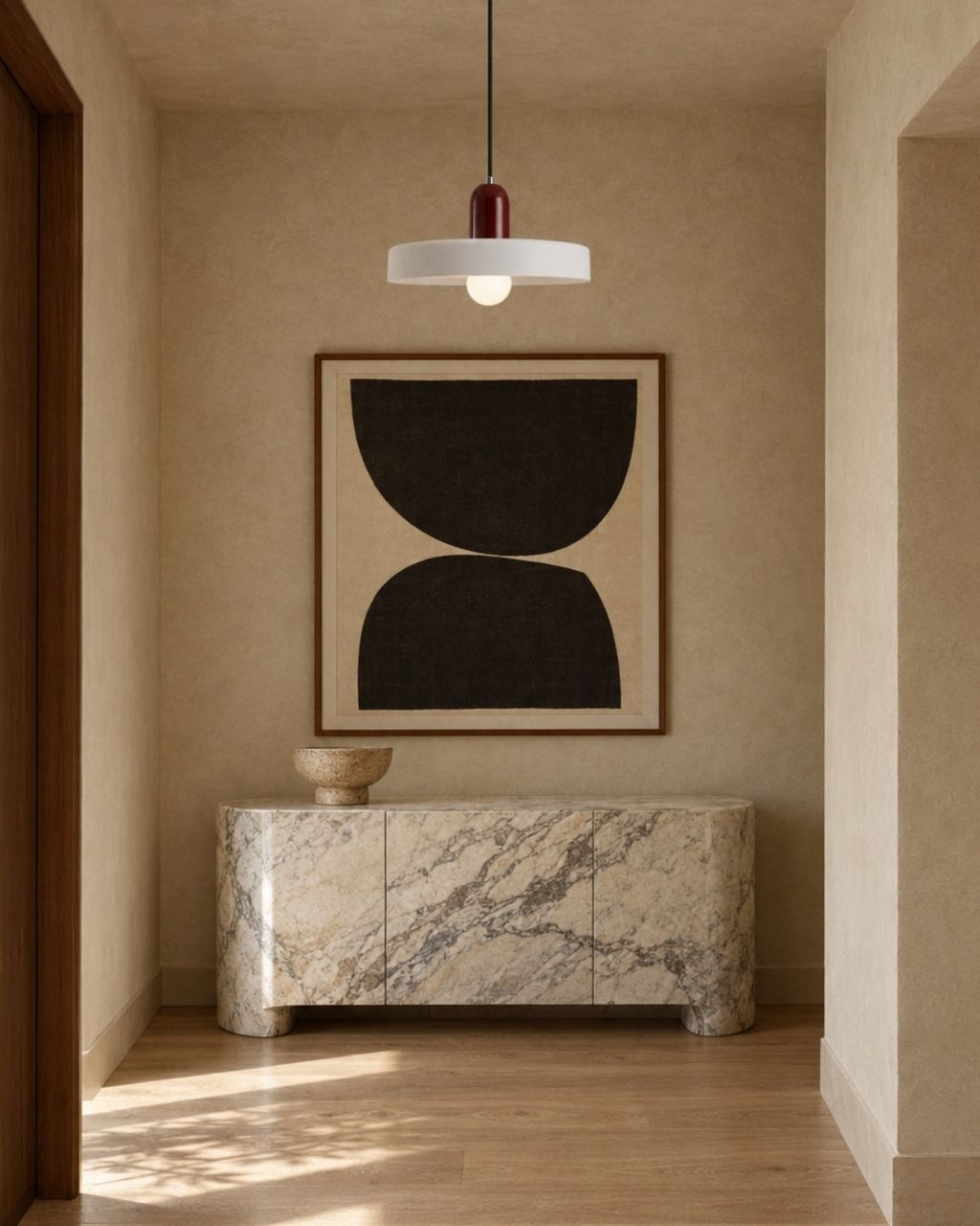 Nyla pendant light in red and white, hanging in a hallway with artwork and wood panelling