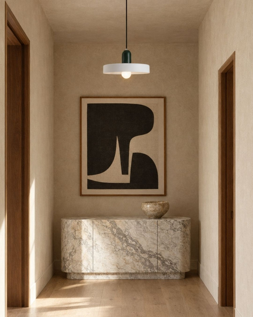 Nyla pendant light in white and green, hanging in a hallway with marble and wood