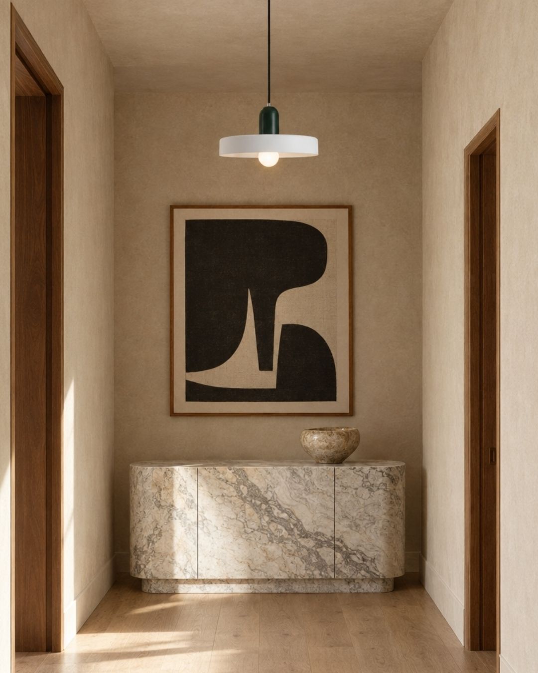 Nyla pendant light in white and green, hanging in a hallway with marble and wood
