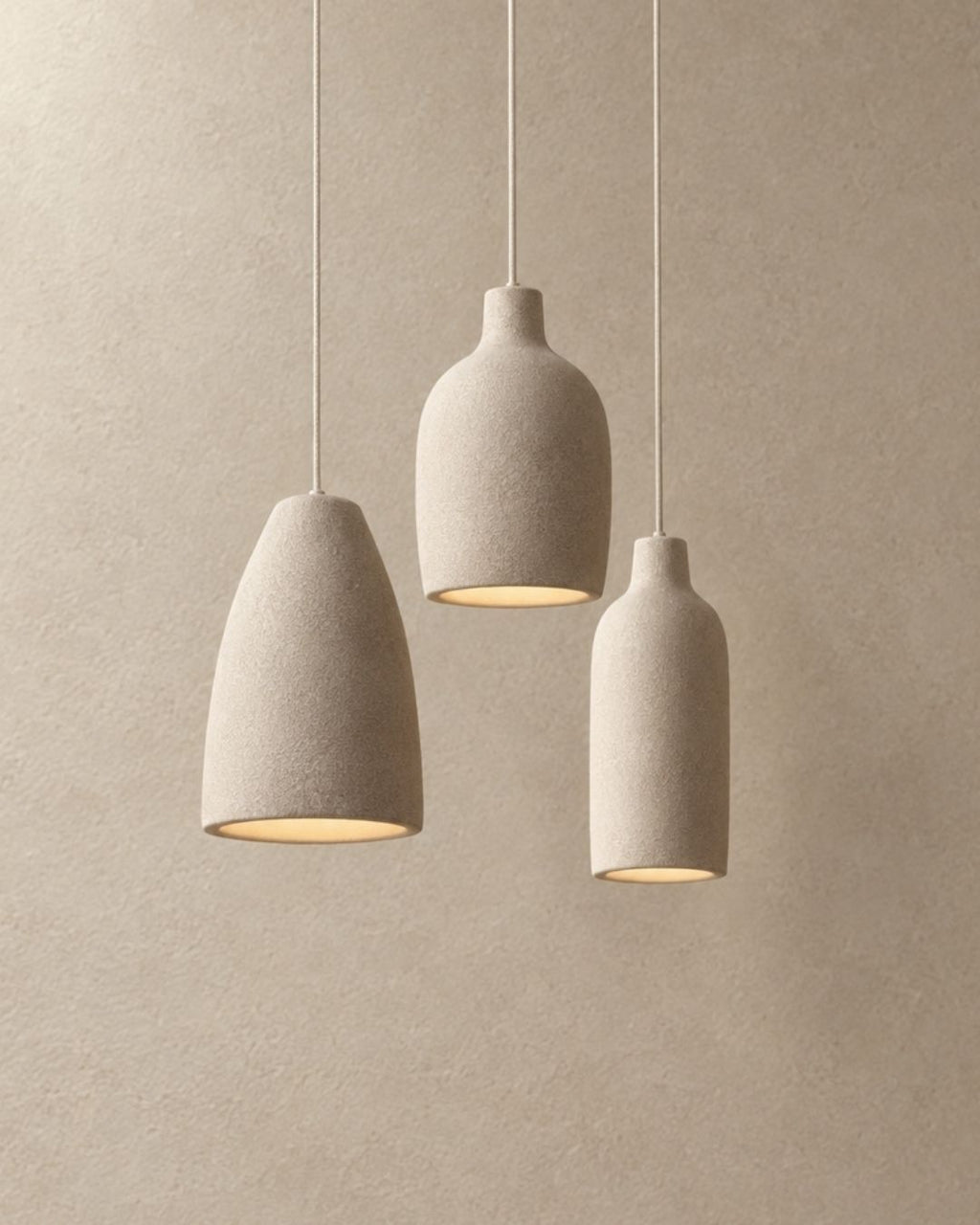 Ovana pendant light in beige, trio of fixtures, product photograph