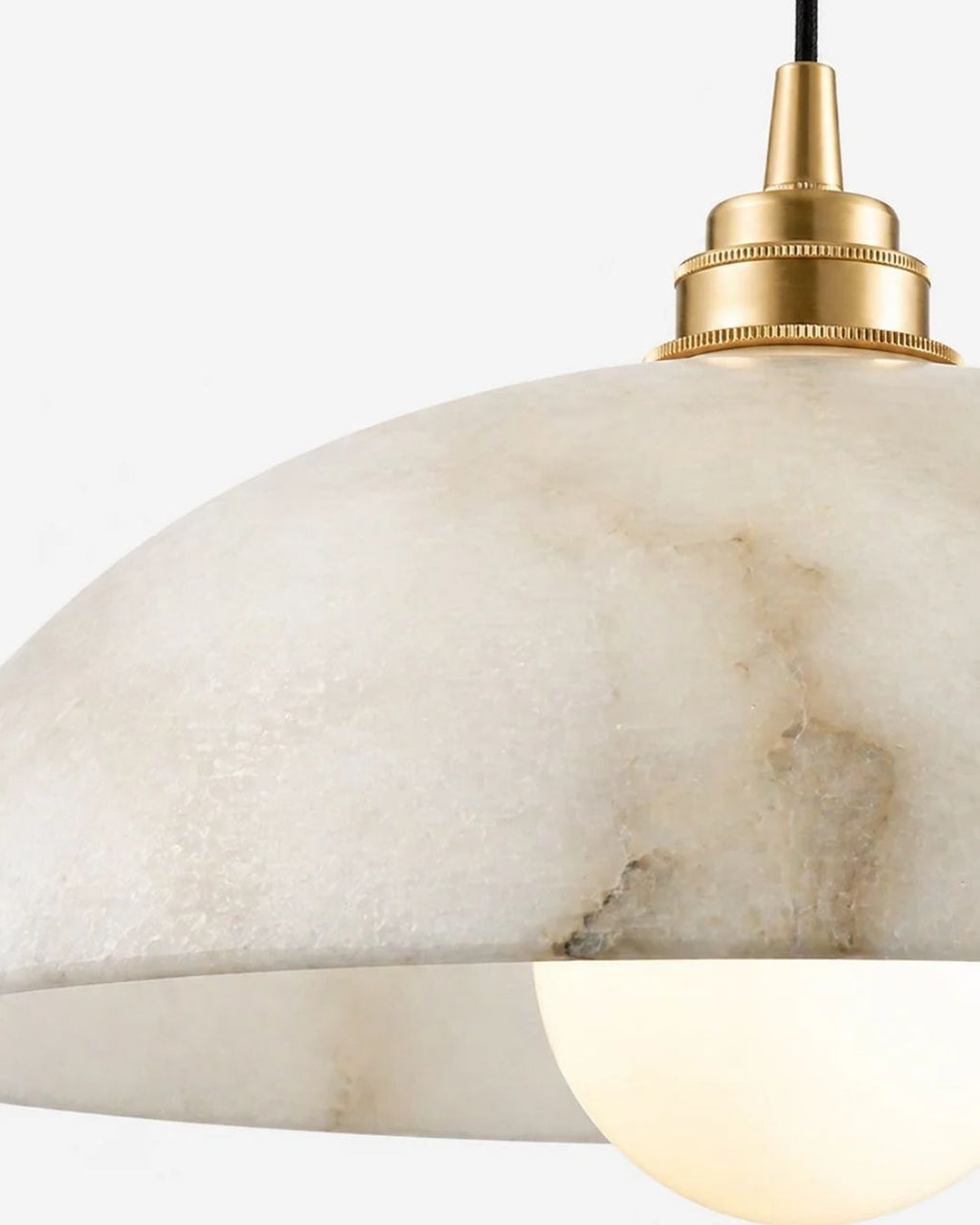 Solvi pendant light in gold, close view of the marble body