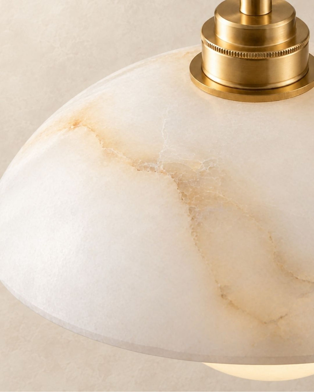 Solvi pendant light in gold, close view from above