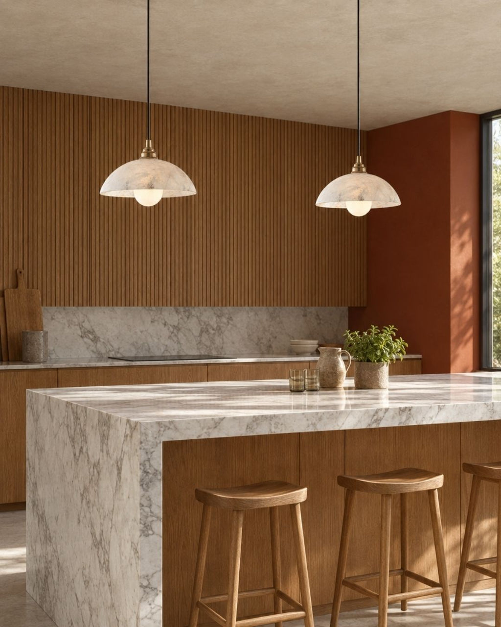 Solvi pendant light in marble and gold, two fixtures in a luxury kitchen