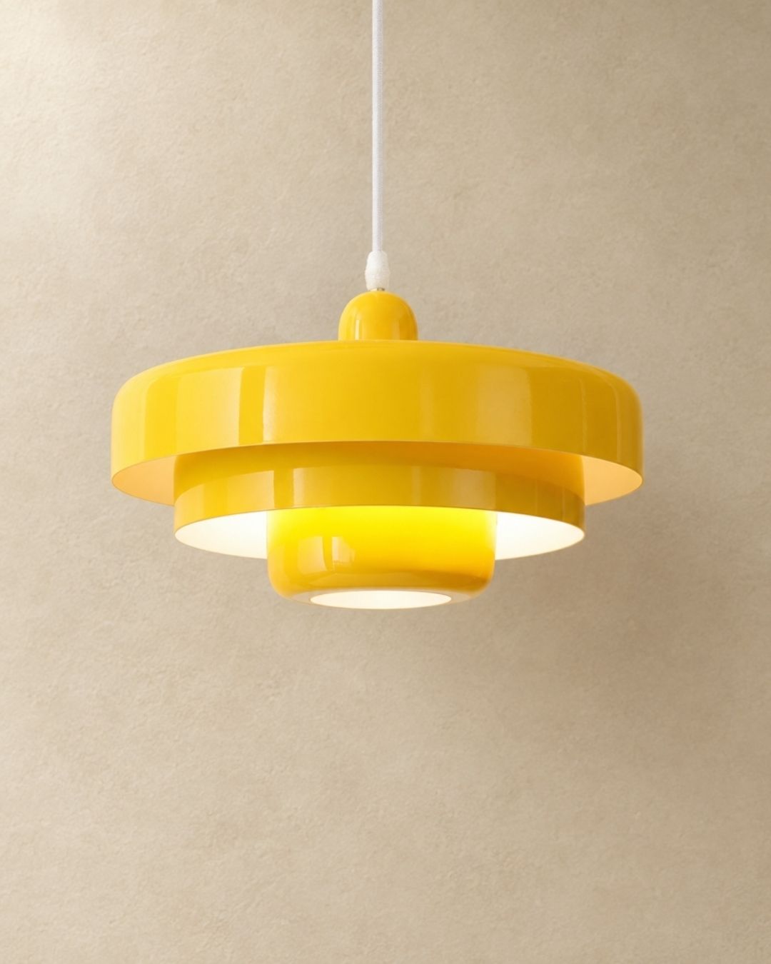 Tessia pendant light in yellow, product photograph
