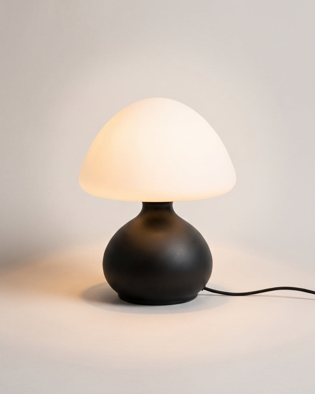 Garlen table lamp in black, opal glass shade on a slender base