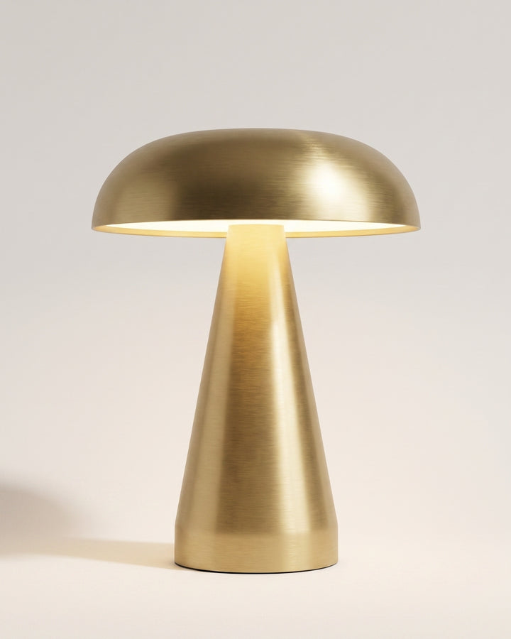 Cerlin table lamp in gold, domed shade on a tapered base