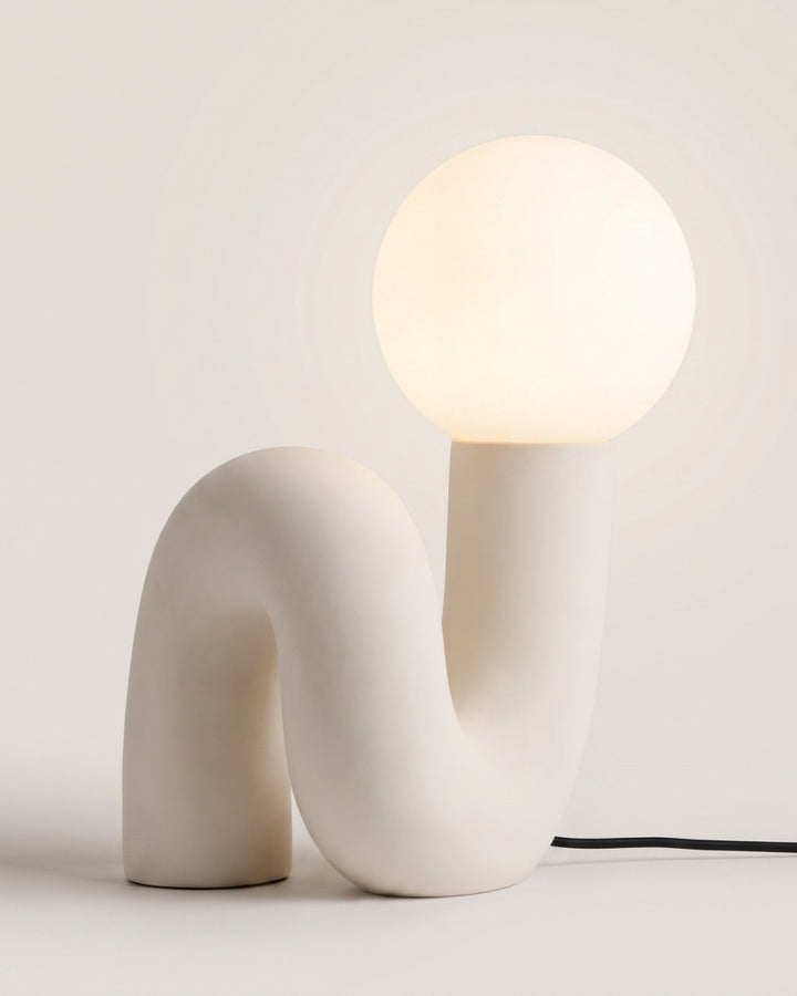 Elocci table lamp in white, sculptural curved form