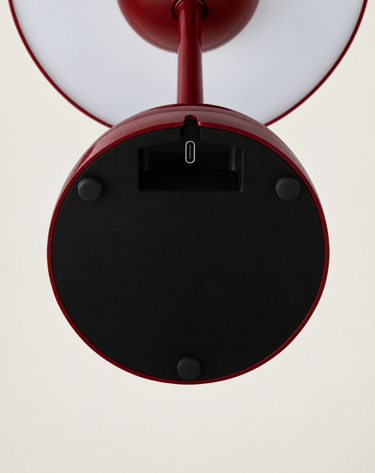 Elsin table lamp in Cherry red, underside of the base with charging port